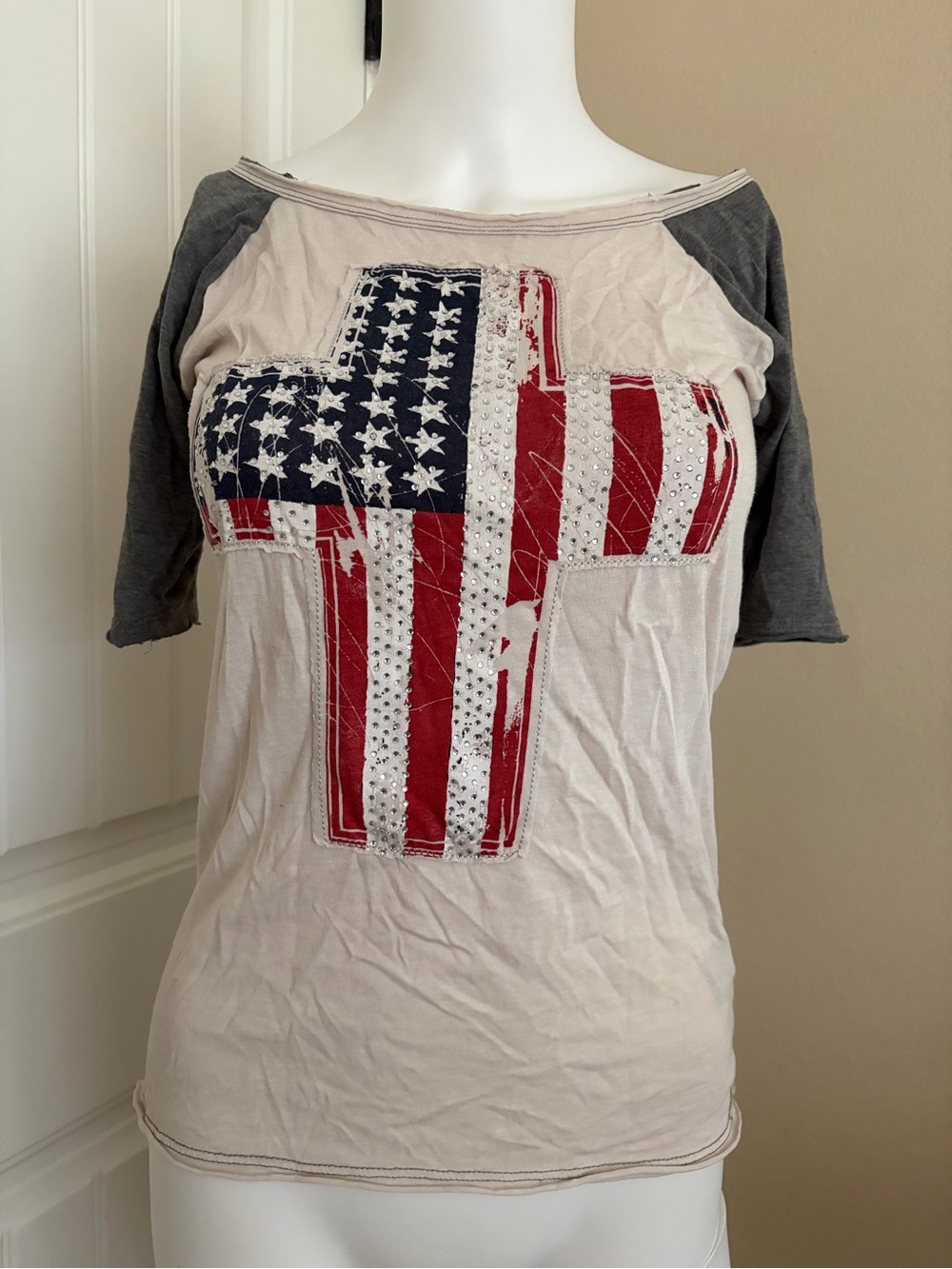 Rock & Roll Cowgirl Cream Rhinestone Tee with Flag Cross and Gray Raglan Sleeves